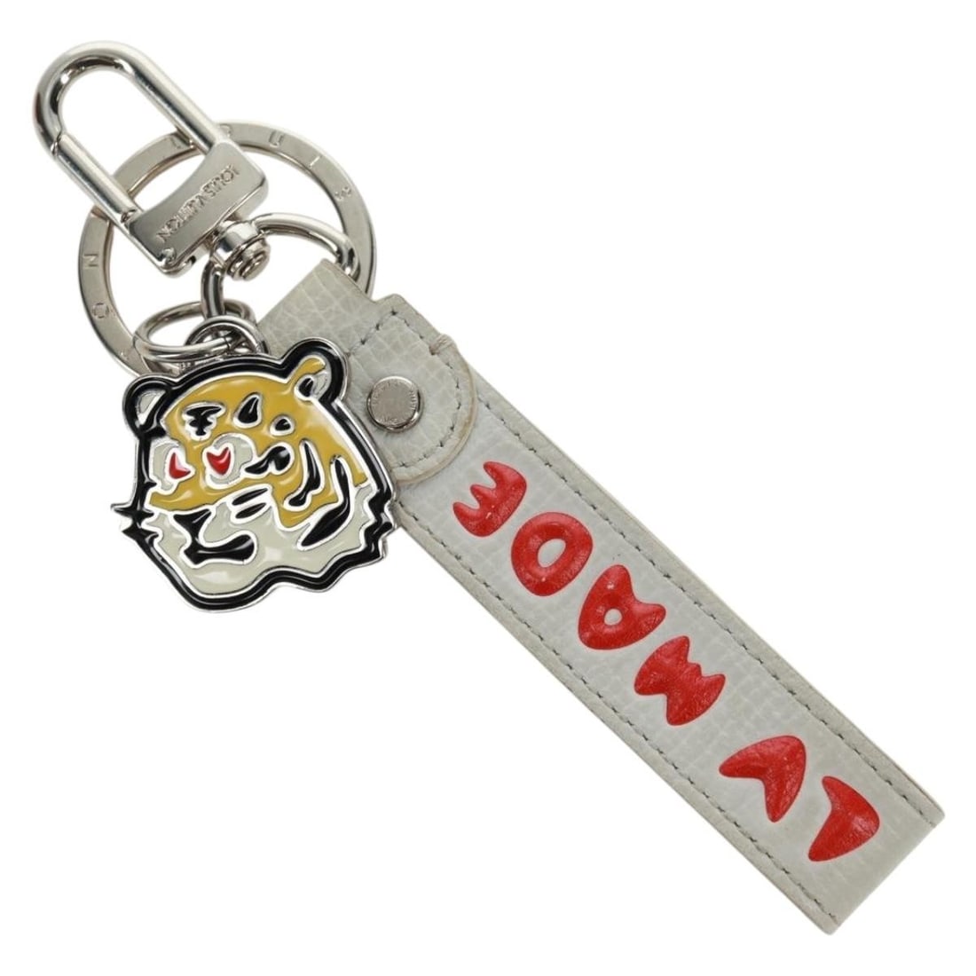 Nigo Edition White Metal Dragonne Key Ring by Louis Vuitton MP3225: Nigo Edition White Metal Dragonne Key Ring by Louis Vuitton MP3225 This Louis Vuitton x Nigo collaboration Dragonne key ring features a stylish design crafted from metal in a white finish. Made in Ita