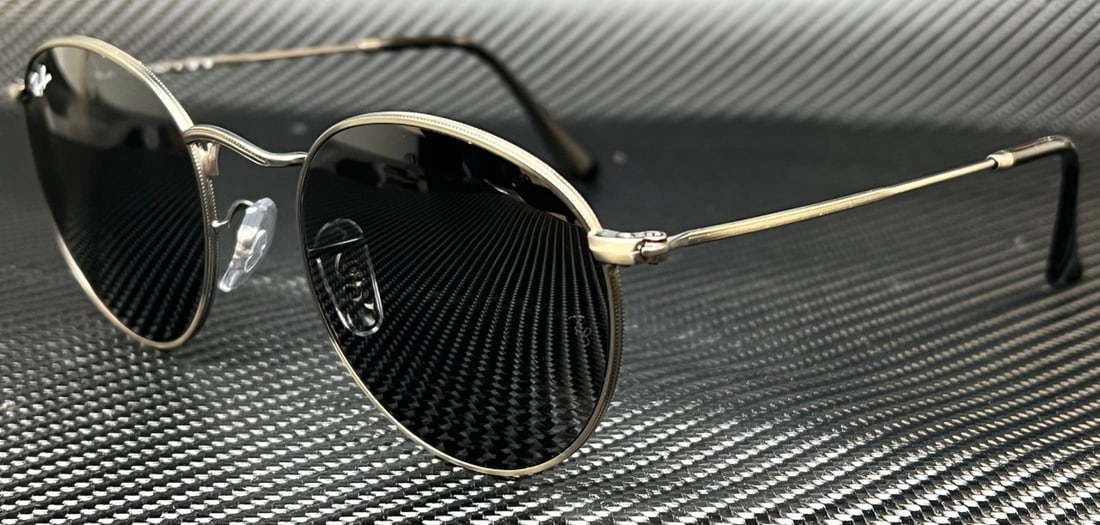 Ray-Ban RB3447 9229B1 Gunmetal Dark Grey Unisex Sunglasses: Ray-Ban RB3447 9229B1 Gunmetal Dark Grey Unisex Sunglasses Elevate your style with these Ray-Ban RB3447 sunglasses, featuring a sleek gunmetal frame and dark grey lenses. Designed for unisex appeal, t