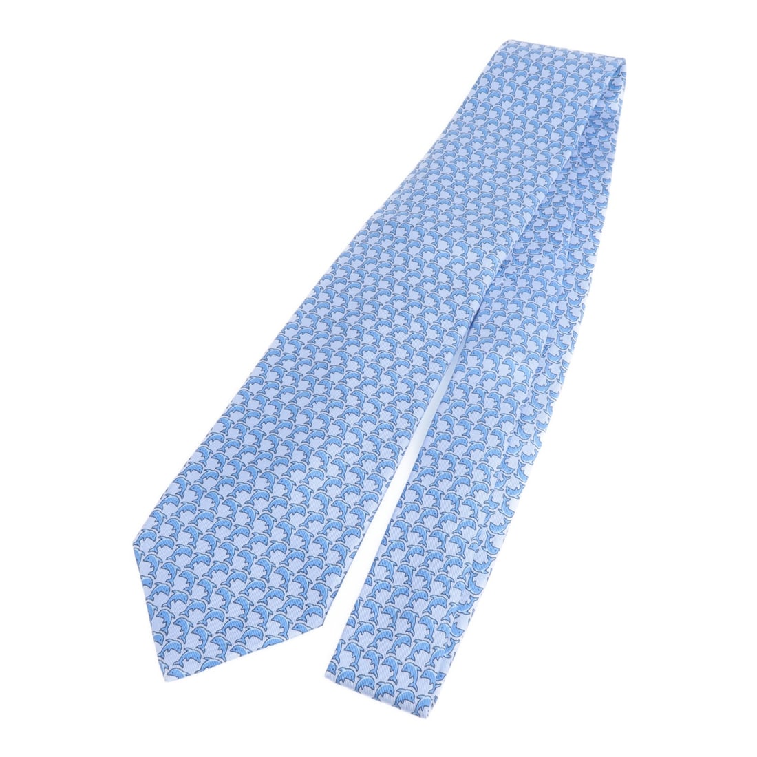 Blue Silk Tie from Hermes Paris: Blue Silk Tie from Hermes Paris This Hermes necktie is crafted from silk and features a classic blue color. Made in France, it offers a timeless style suitable for a regular size type. The tie is in v