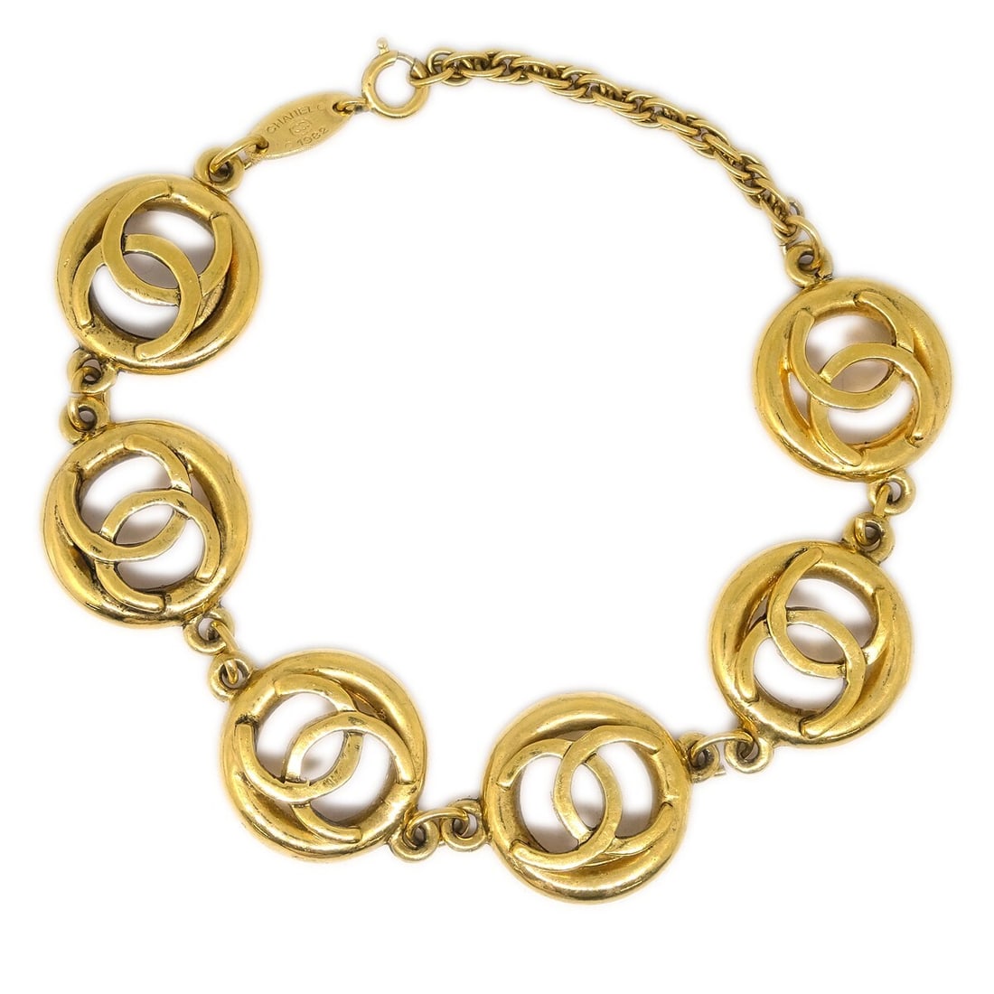Chanel CC Logo Gold-Plated Bracelet Vintage 1982: Chanel CC Logo Gold-Plated Bracelet Vintage 1982 Enhance your accessory collection with this stunning Chanel CC Bracelet from 1982. Crafted with a luxurious gold-plated finish, this bracelet showcases