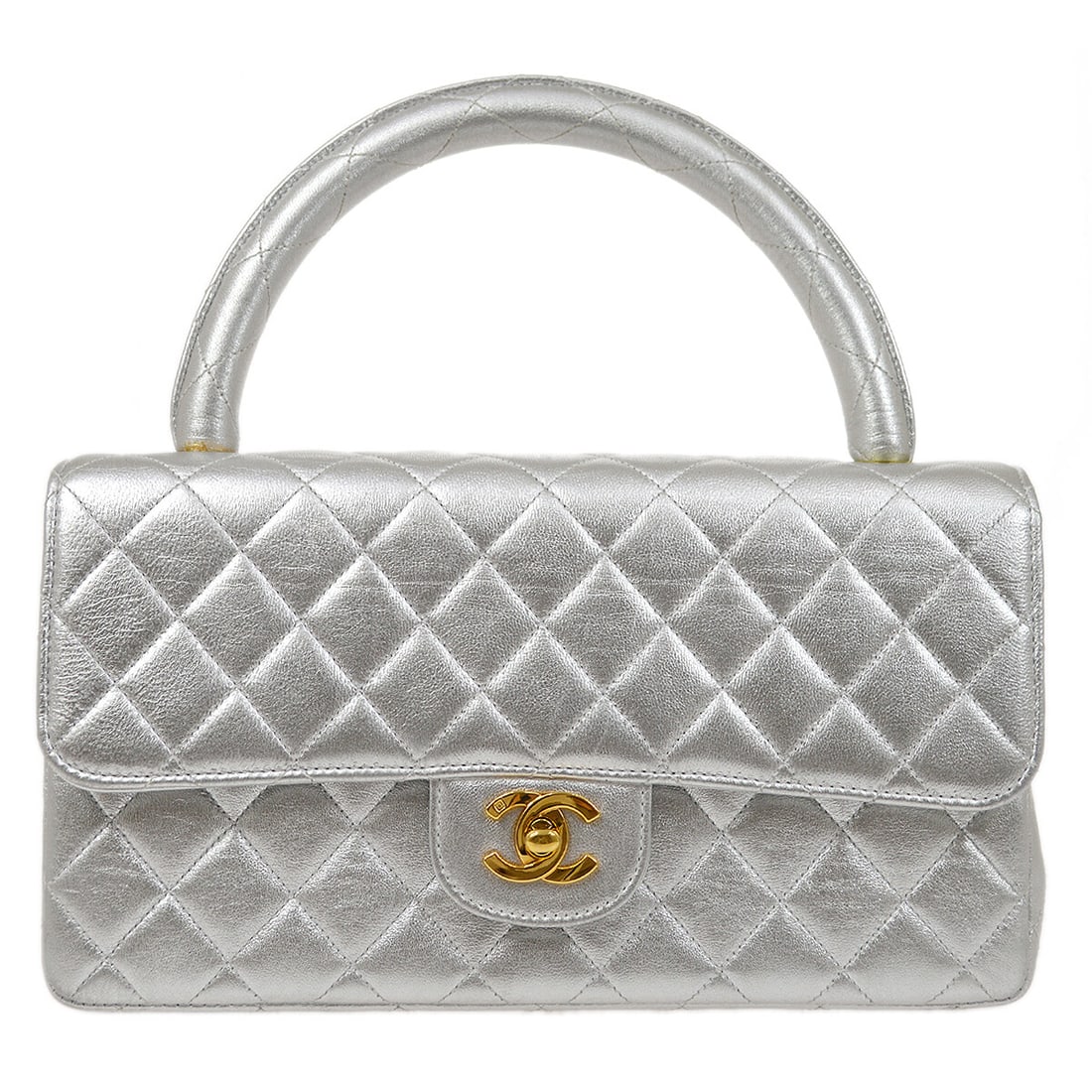 Chanel Silver Lambskin Quilted Top Handle Handbag: Chanel Silver Lambskin Quilted Top Handle Handbag This elegant Chanel Top Handle Handbag is crafted from luxurious silver lambskin leather, featuring a signature quilted design. The medium-sized handb