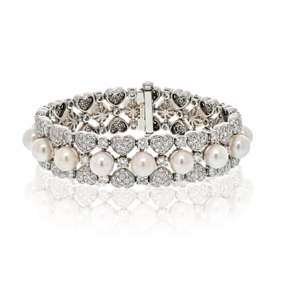 18K White Gold 15.00ct Round Diamond Pearl Bracelet: 18K White Gold 15.00ct Round Diamond Pearl Bracelet The 18K White Gold 15.00cttw Round Diamond and Pearl One Line Bracelet is a breathtaking piece that exquisitely blends the brilliance of diamonds wi