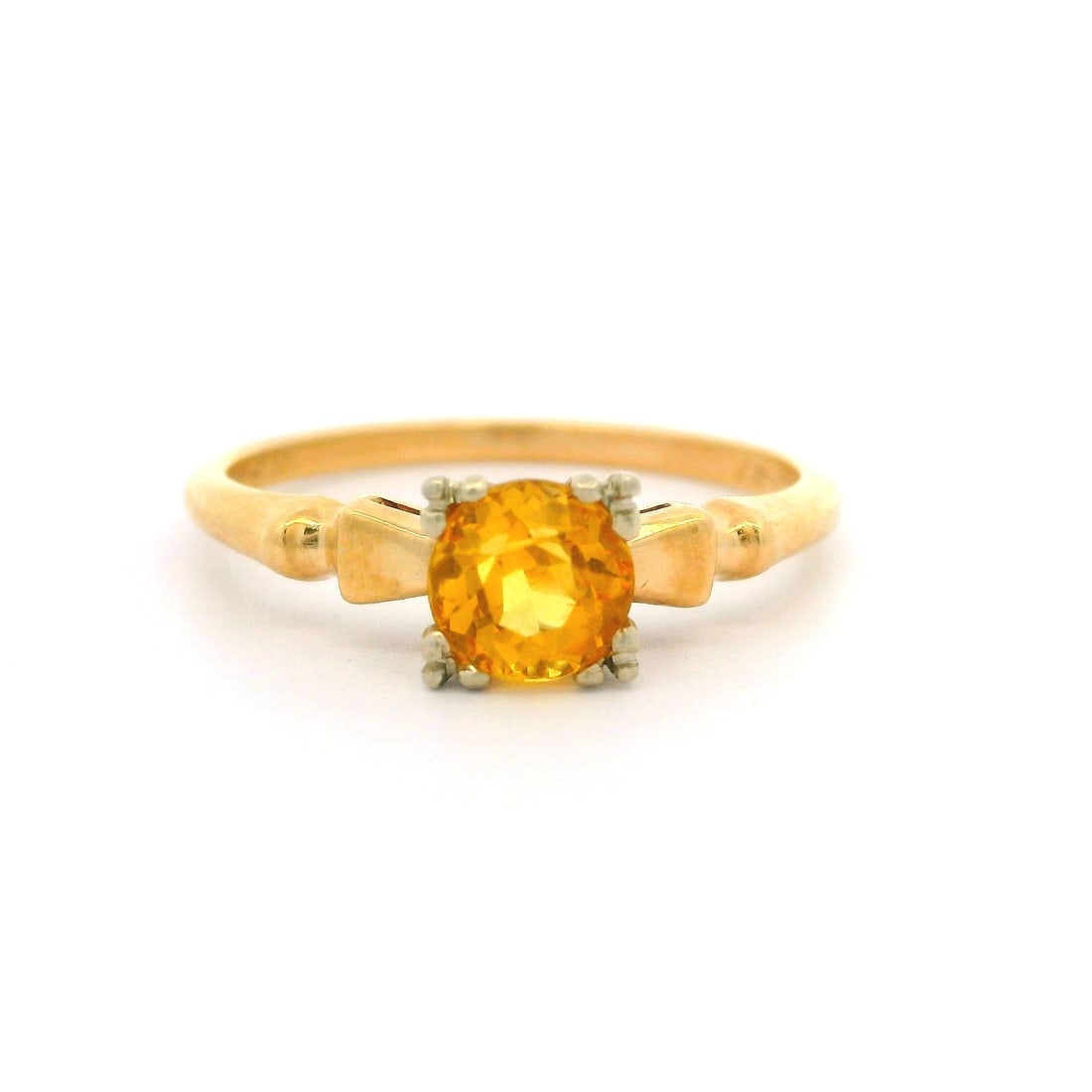 Vintage 14k Yellow Gold Citrine Solitaire Engagement Ring: Vintage 14k Yellow Gold Citrine Solitaire Engagement Ring This vintage 14k yellow gold engagement ring showcases a stunning old mine cut yellow citrine, prong set to highlight its vivid yellow color.