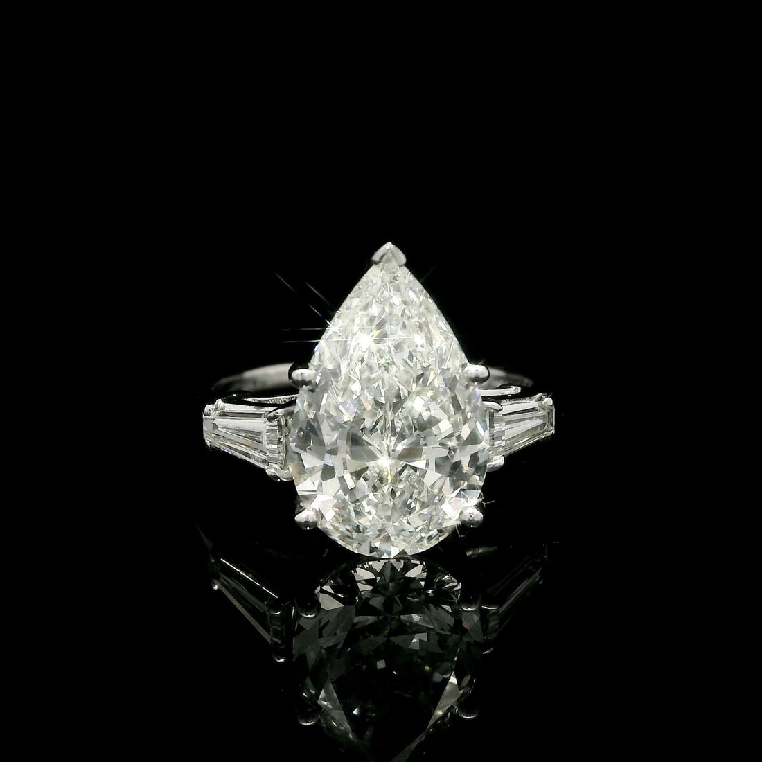 GIA Certified 3.81ctw Platinum Pear Diamond Engagement Ring: GIA Certified 3.81ctw Platinum Pear Diamond Engagement Ring This stunning engagement ring features a breathtaking natural diamond at its center, showcasing a pear brilliant cut with a total carat weig