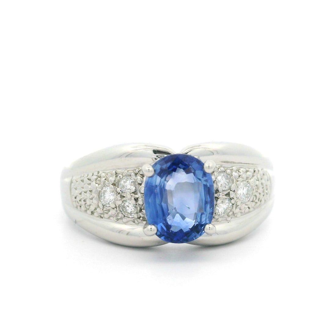 Platinum 1.32ct Oval Blue Sapphire Diamond Band Ring: Platinum 1.32ct Oval Blue Sapphire Diamond Band Ring This stunning ring features a solid platinum band adorned with a captivating 1.32 carat total weight of gemstones. At the center lies a natural, ov
