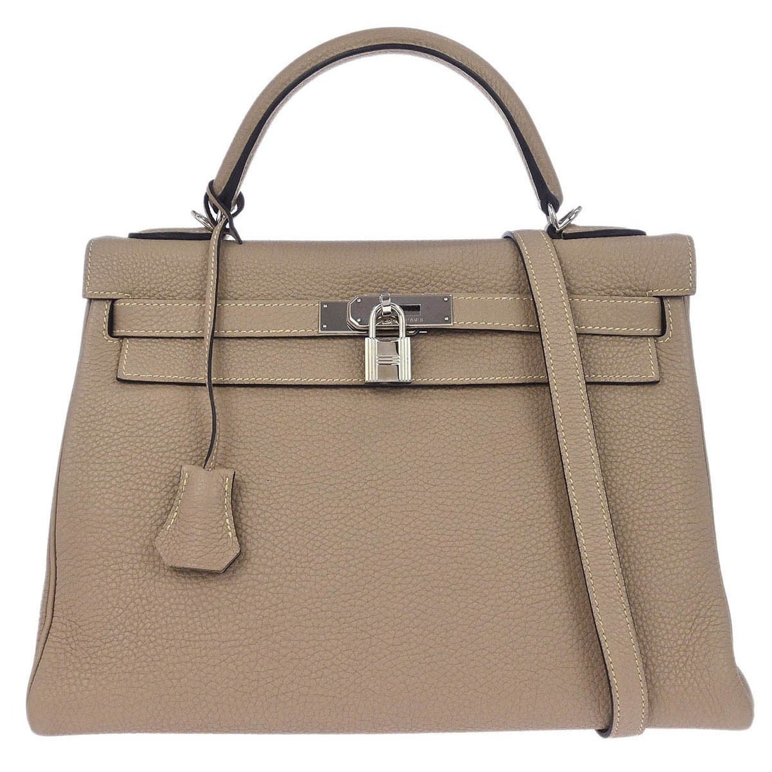 Argile Leather Kelly 32 Retourne Satchel with Detachable Strap by Hermes: Argile Leather Kelly 32 Retourne Satchel with Detachable Strap by Hermes This Hermes Kelly 32 Retourne handbag features Argile Togo leather with a medium-sized silhouette. The bag includes a top handl