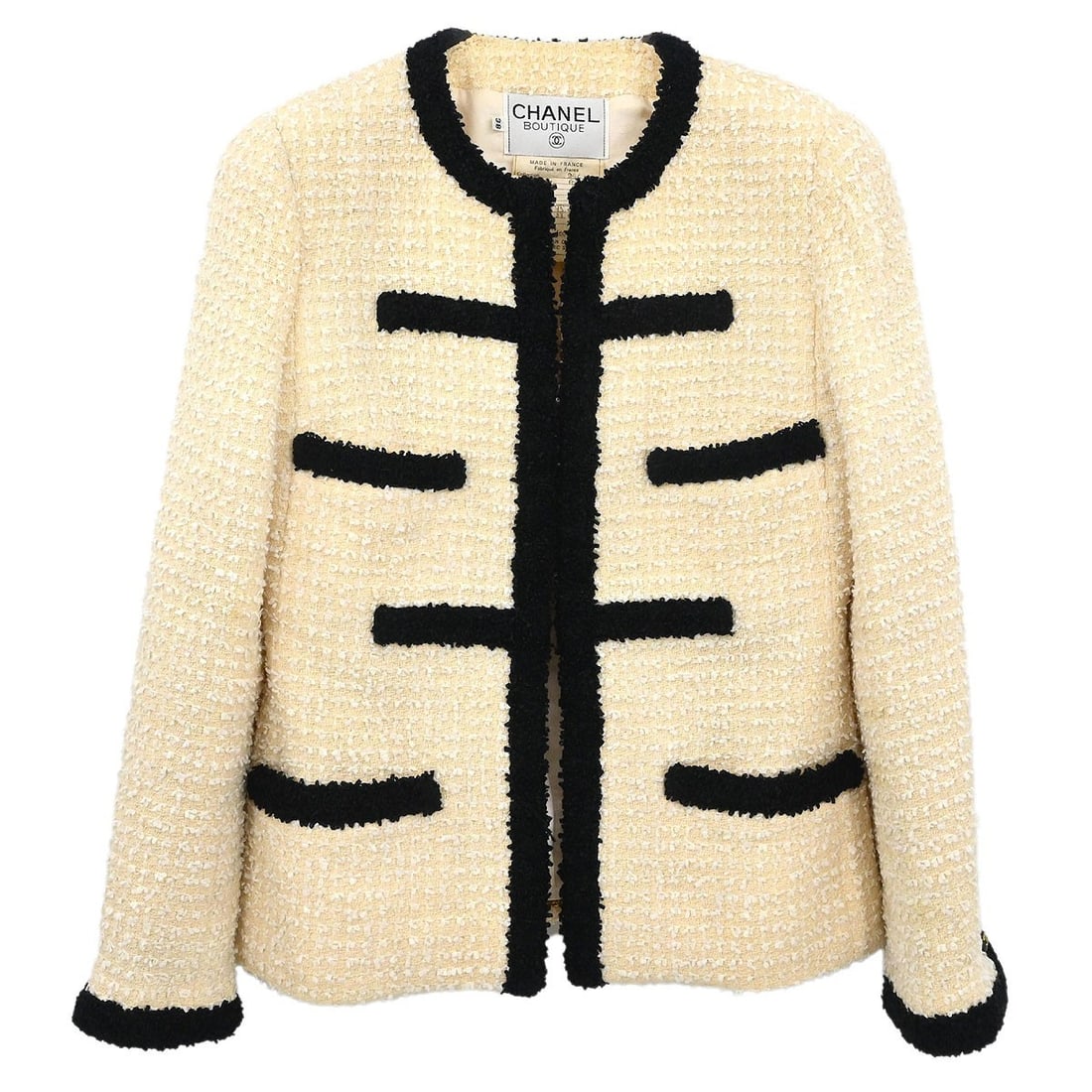 Off-white Collarless Mid-Length Wool Jacket by Chanel Size 38: Off-white Collarless Mid-Length Wool Jacket by Chanel Size 38 This Chanel collarless single breasted jacket in off-white features a mid-length cut and long sleeves, crafted from a blend of 73% wool an