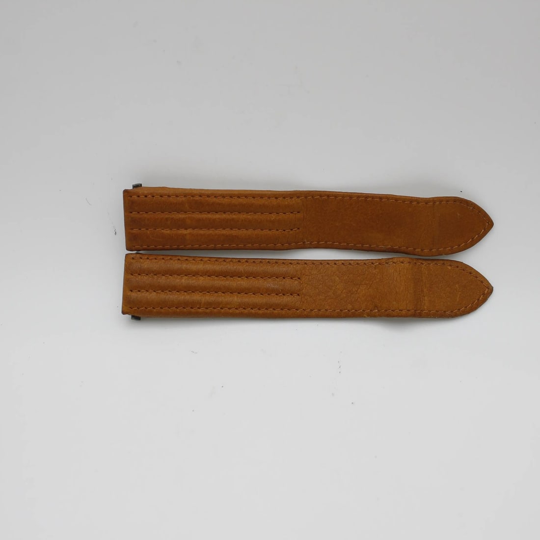 Brown Leather Watch Strap for Cartier CGK 19mm x 18mm: Brown Leather Watch Strap for Cartier CGK 19mm x 18mm This pre-owned Cartier wristwatch band is crafted from brown leather and designed in a two-piece strap style. It is compatible with Cartier CGK mo