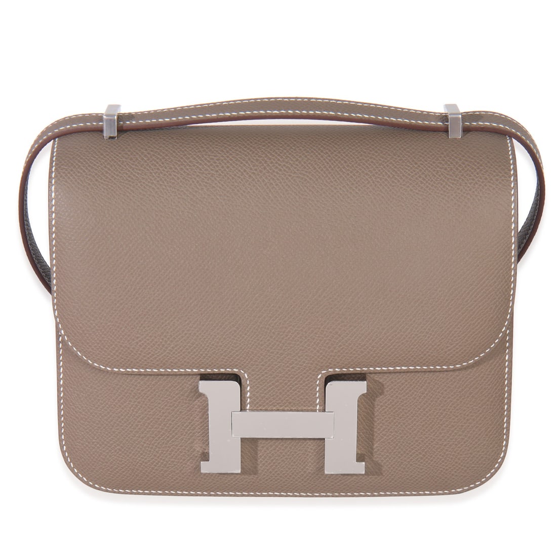 Constance 18 Epsom Leather Crossbody in Etoupe with Palladium Hardware: Constance 18 Epsom Leather Crossbody in Etoupe with Palladium Hardware This Hermes Constance 18 is crafted from Epsom leather in an Etoupe color with brown and gray tones. The bag features a structure