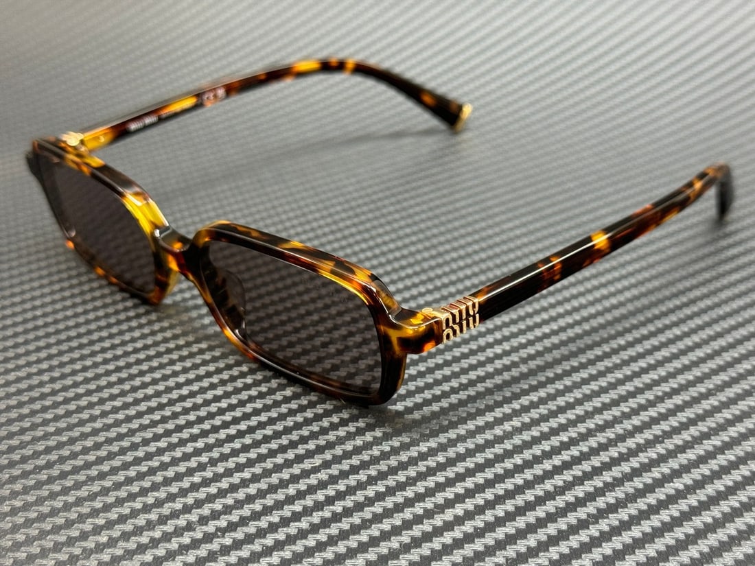 Miu Miu MU 11ZSF 14L20I Havana Honey Purple Women's Sunglasses: Miu Miu MU 11ZSF 14L20I Havana Honey Purple Women's Sunglasses Elevate your style with these stunning Miu Miu sunglasses, model MU 11ZSF 14L20I. Featuring a chic Havana Honey frame, they are complemen