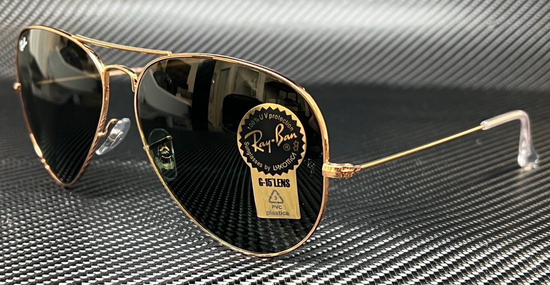 Ray-Ban RB3025 920231 Rose Gold Aviator Sunglasses with Green Lenses: Ray-Ban RB3025 920231 Rose Gold Aviator Sunglasses with Green Lenses Elevate your style with these Ray-Ban RB3025 920231 Aviator Sunglasses. Featuring a striking rose gold frame paired with vibrant gr