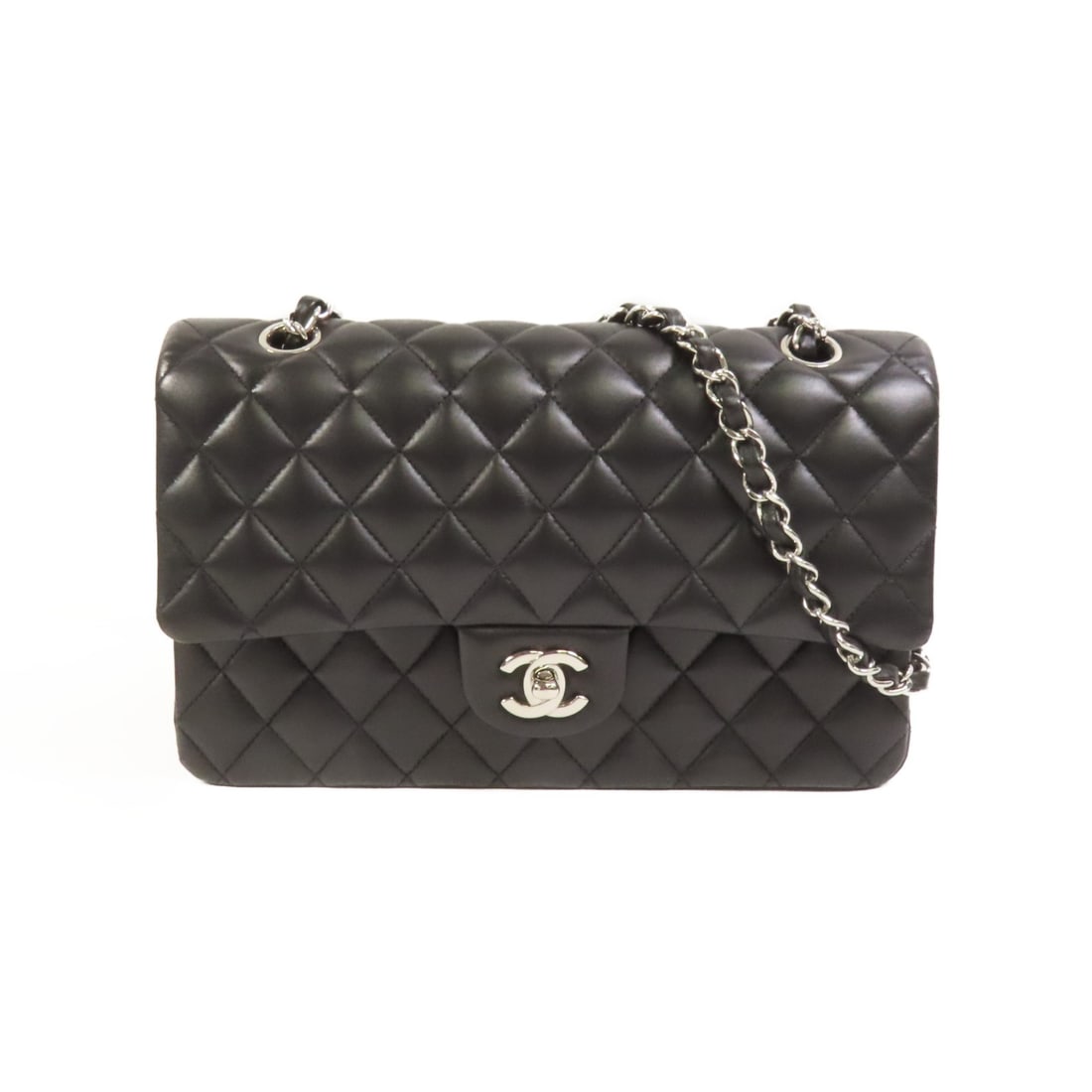 Black Lambskin Classic 25 Shoulder Bag by Chanel with Silver Hardware: Black Lambskin Classic 25 Shoulder Bag by Chanel with Silver Hardware This CHANEL Classic 25 chain shoulder bag is crafted from black lambskin leather and features a silver-tone CC logo. Designed in a