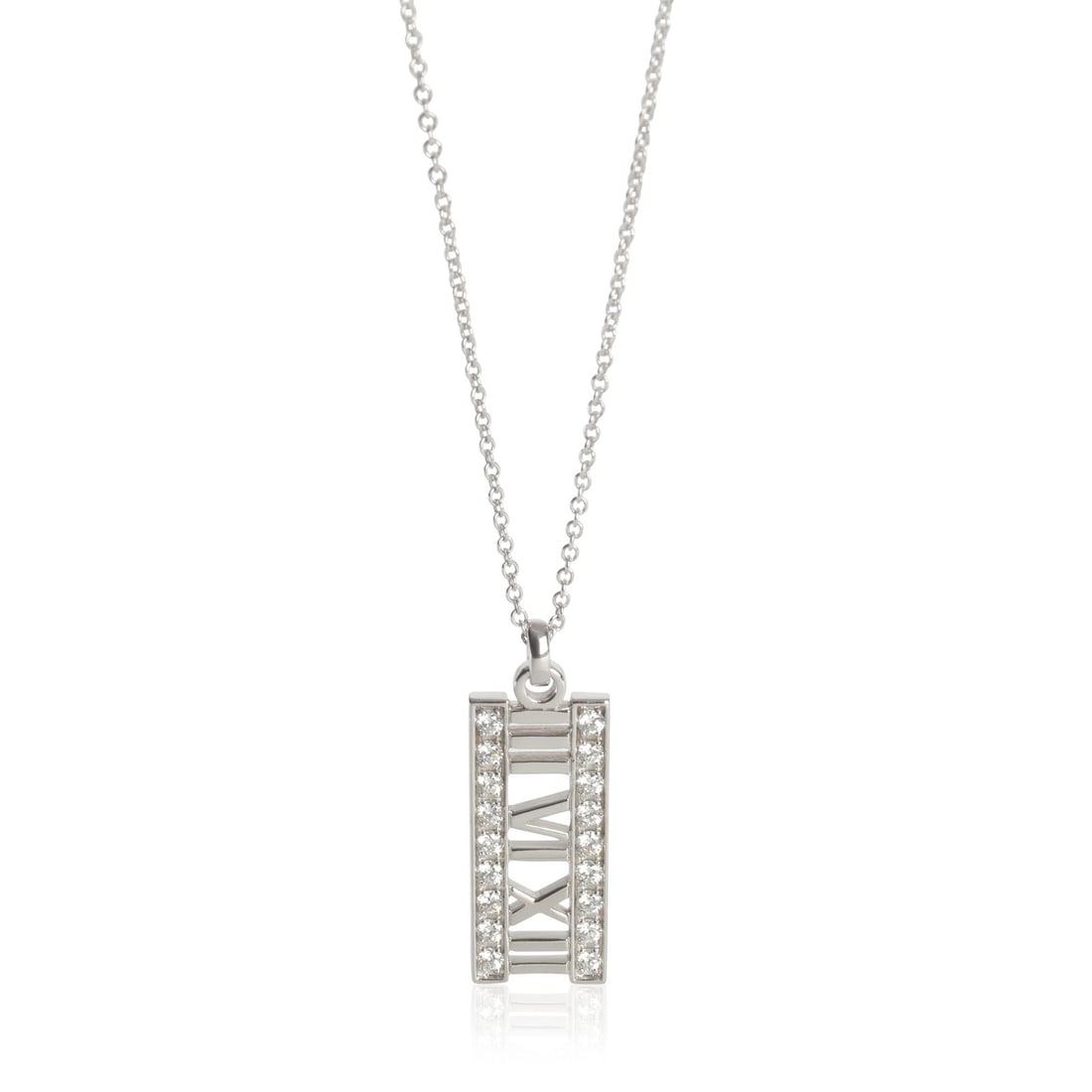 Atlas Bar 18k White Gold Diamond Pendant by Tiffany & Co.: Atlas Bar 18k White Gold Diamond Pendant by Tiffany & Co. This Tiffany & Co. Atlas Bar pendant features round brilliant diamonds set in 18k white gold. The necklace measures 16 inches in length and is