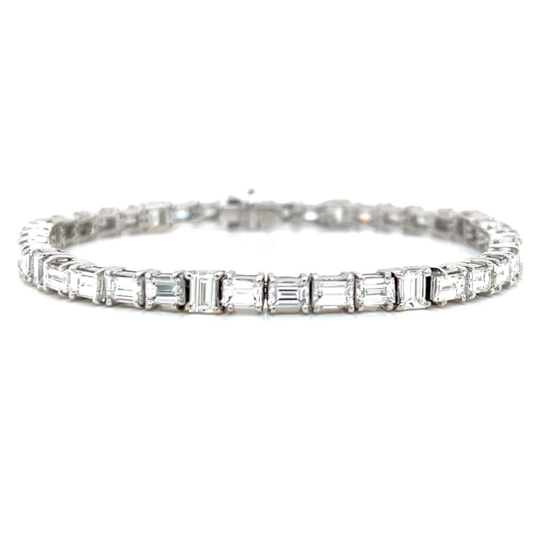 Elegant Platinum 12.00 Ct Baguette Diamond Tennis Bracelet: Elegant Platinum 12.00 Ct Baguette Diamond Tennis Bracelet This exquisite platinum diamond tennis bracelet features a stunning array of 41 baguette diamonds, totaling approximately 12.00 carats. The d