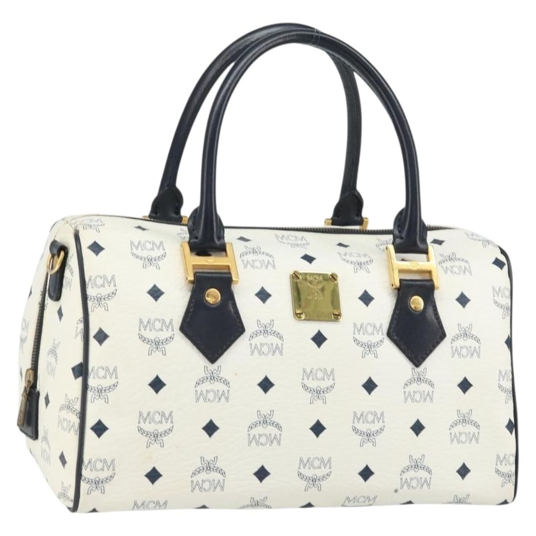 White and Gold PVC Leather Boston Bag by MCM Vicetos Logogram: White and Gold PVC Leather Boston Bag by MCM Vicetos Logogram This MCM Boston Bag features the signature Vicetos logogram design in white and gold PVC leather. Crafted in Germany, it offers a classic