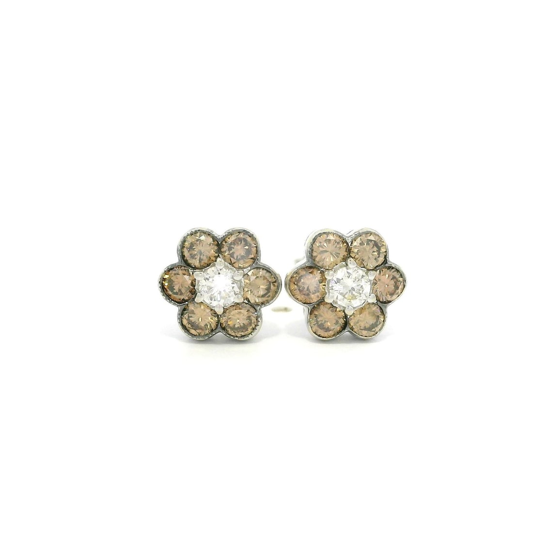 18k White Gold Fancy Brown White Diamond Flower Cluster Stud Earrings: 18k White Gold Fancy Brown White Diamond Flower Cluster Stud Earrings Elevate your style with these exquisite 18k White Gold Fancy Brown and White Diamond Flower Cluster Stud Earrings. Featuring a stu