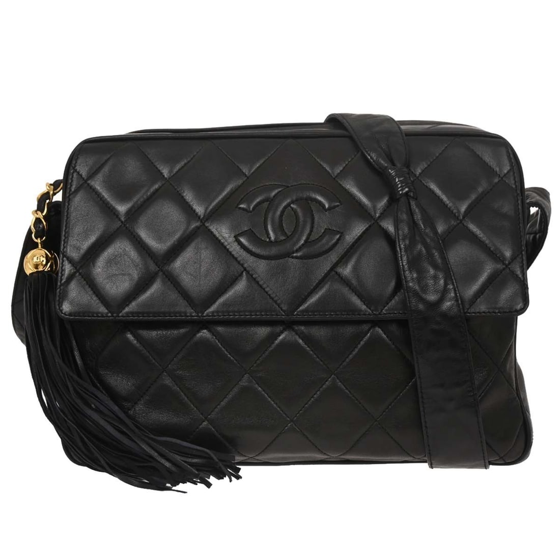 Chanel Medium Black Lambskin Shoulder Bag with Fringe Detail: Chanel Medium Black Lambskin Shoulder Bag with Fringe Detail This Chanel shoulder bag is crafted from black lambskin and features a stylish fringe detail. It is designed in a medium size with a zip cl