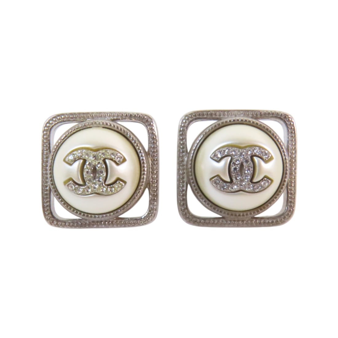 CHANEL CC GHW White Gold Tone Strass Pierced Earrings: CHANEL CC GHW White Gold Tone Strass Pierced Earrings Elevate your style with these elegant CHANEL CC earrings. Designed in a stunning white color, these pierced earrings feature a chic gold-tone hard