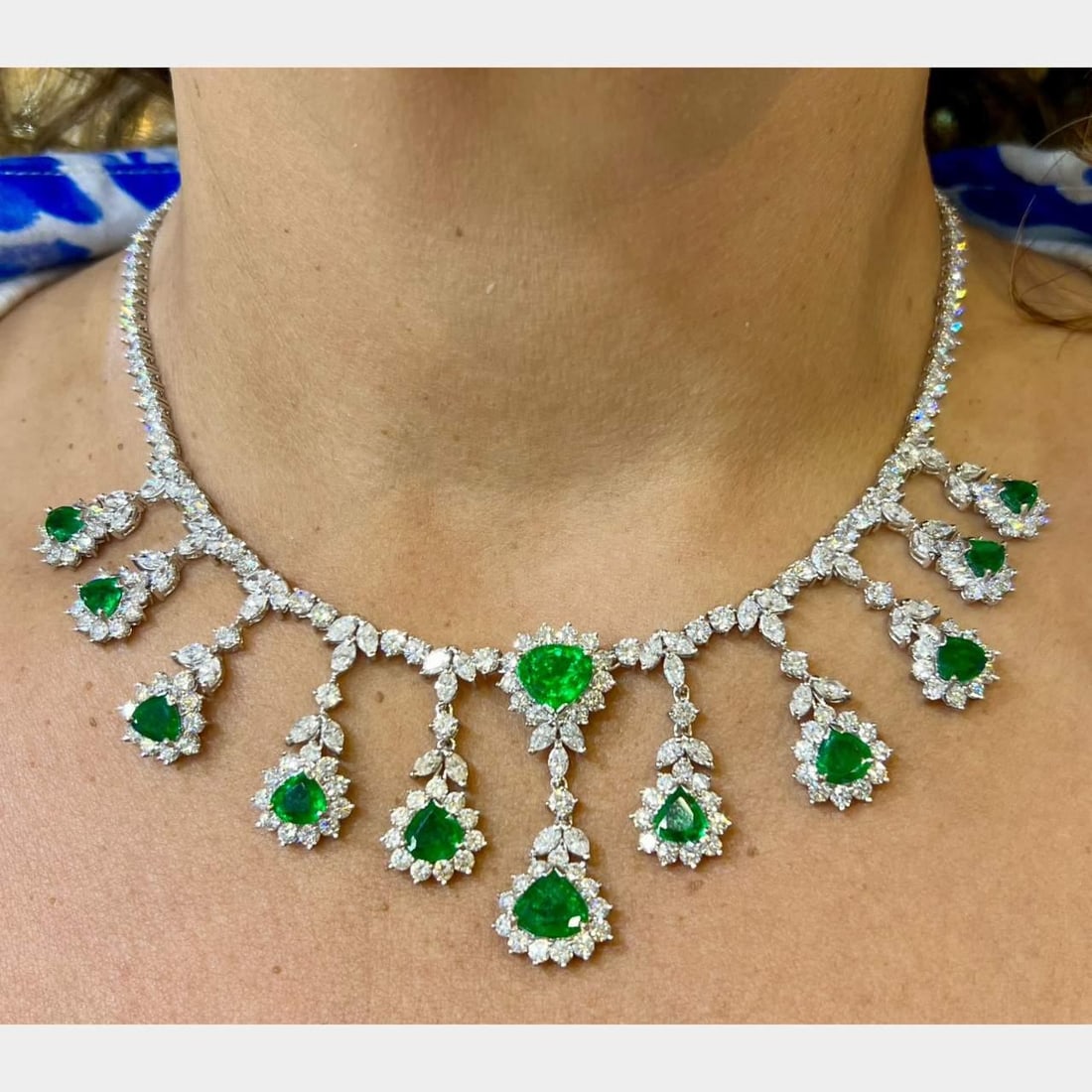 Colombian Emerald and Diamond Necklace in 18K White Gold 16.25 Inch: Colombian Emerald and Diamond Necklace in 18K White Gold 16.25 Inch This pre-owned necklace is crafted from 18K white gold and features 12 Colombian emeralds with a total stamped weight of 14.01 carat