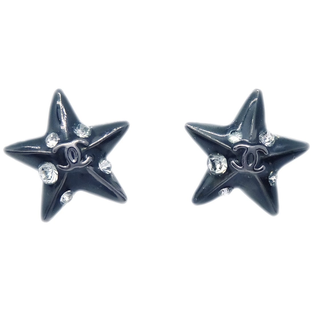 Chanel Black Star Rhinestone Piercing Earrings 03A: Chanel Black Star Rhinestone Piercing Earrings 03A These exquisite Chanel star-shaped earrings are adorned with sparkling rhinestones, making them a striking accessory for any outfit. Designed with a