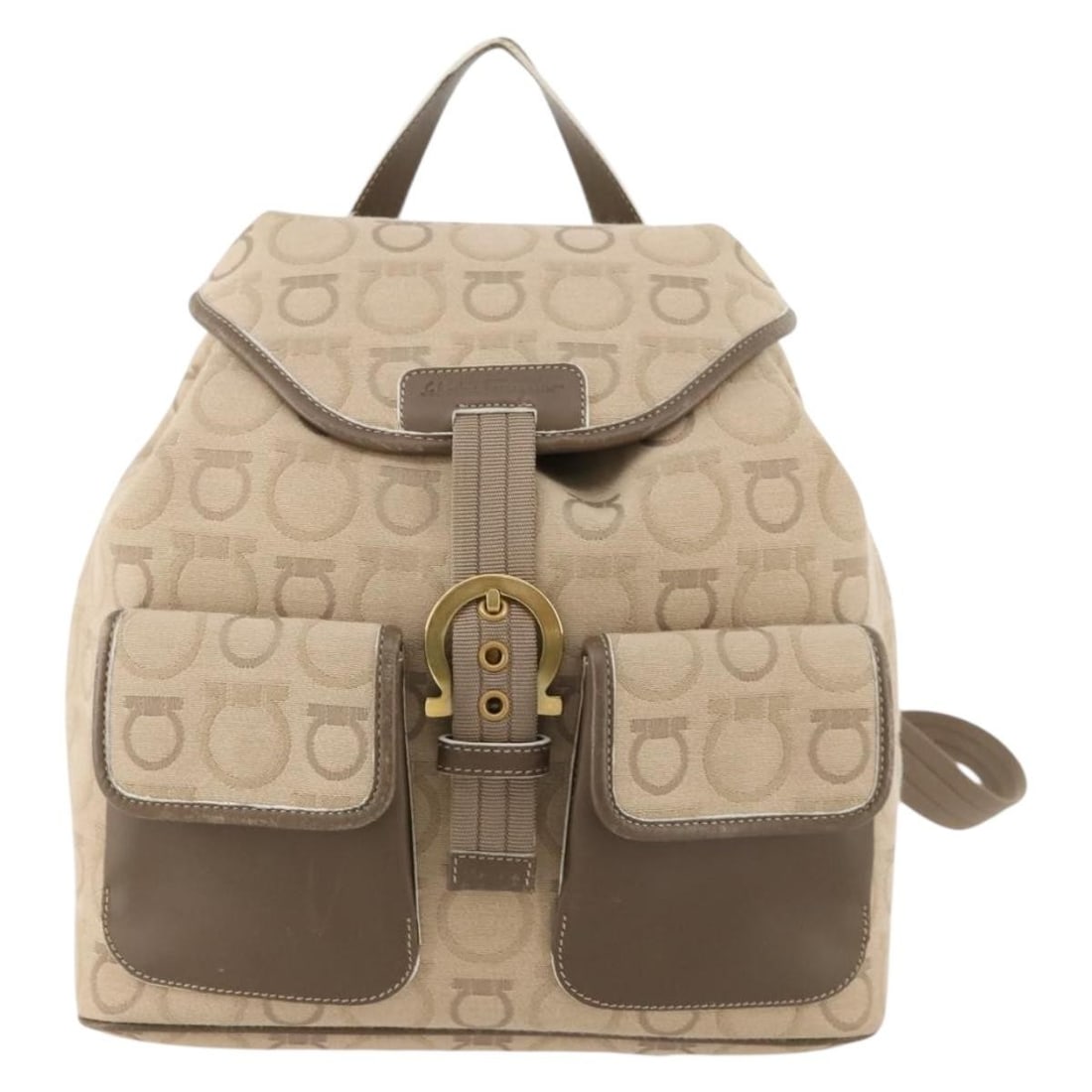 Gancini Canvas Backpack by Salvatore Ferragamo in Beige: Gancini Canvas Backpack by Salvatore Ferragamo in Beige This Salvatore Ferragamo Gancini Backpack features a beige canvas exterior with leather accents and signature Ferragamo metal fittings. Designed