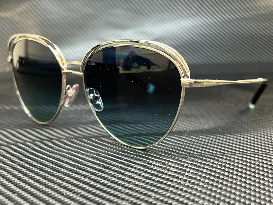 Tiffany & Co. TF3075 60019S Women's Silver Round Sunglasses: Tiffany & Co. TF3075 60019S Women's Silver Round Sunglasses Elevate your eyewear collection with these stunning Tiffany & Co. TF3075 60019S sunglasses. Featuring a chic round frame in a sophisticated 