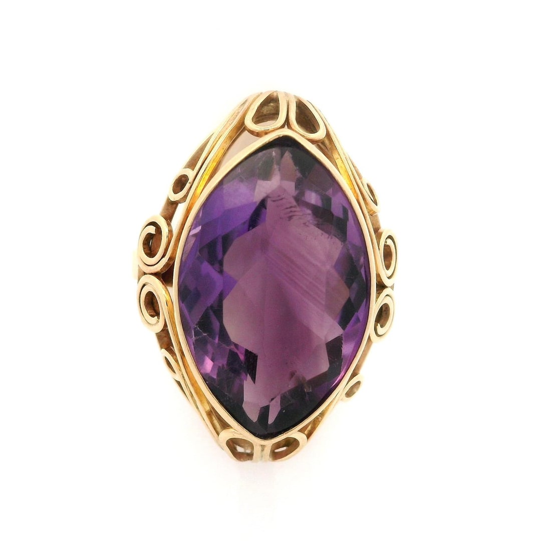 Vintage 14k Yellow Gold Marquise Amethyst Handmade Cocktail Ring: Vintage 14k Yellow Gold Marquise Amethyst Handmade Cocktail Ring This vintage cocktail ring showcases a stunning natural amethyst in a marquise cut, elegantly bezel set in solid 14k yellow gold. The v
