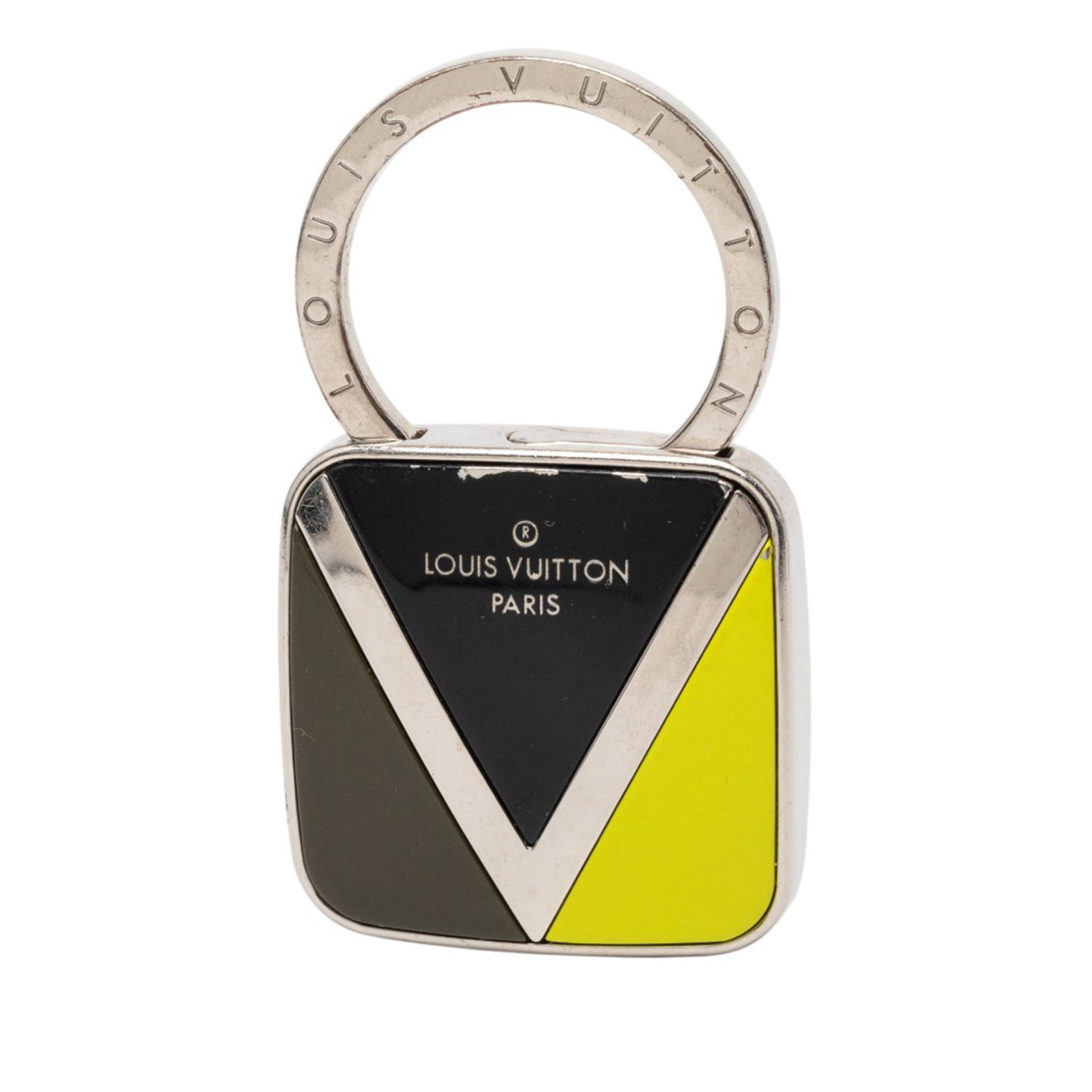 Gaston V Twist Silver Metal Keychain by Louis Vuitton: Gaston V Twist Silver Metal Keychain by Louis Vuitton This Louis Vuitton Gaston V Twist key chain features a metal body with a round closure attachment. It is finished in a silver tone and was crafted