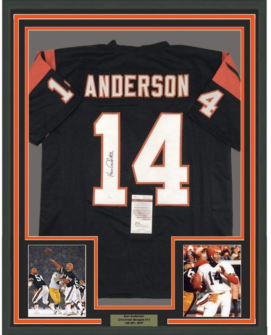 Framed Ken Anderson Autographed Cincinnati Bengals Jersey with JSA COA: Framed Ken Anderson Autographed Cincinnati Bengals Jersey with JSA COA This professionally framed and matted display features an autographed black Cincinnati Bengals jersey signed by NFL legend Ken An