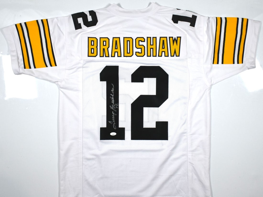 Terry Bradshaw Signed White Football Jersey JSA Authenticated Pittsburgh Steelers: Terry Bradshaw Signed White Football Jersey JSA Authenticated Pittsburgh Steelers This pre-owned white pro style football jersey is autographed by Terry Bradshaw. It represents the Pittsburgh Steelers