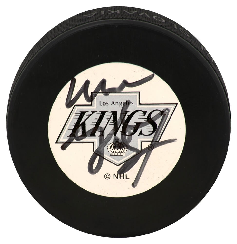Wayne Gretzky Signed Los Angeles Kings Hockey Puck JSA Authenticated: Wayne Gretzky Signed Los Angeles Kings Hockey Puck JSA Authenticated This original hockey puck features the iconic Los Angeles Kings logo and is personally signed by legendary player Wayne Gretzky. Th