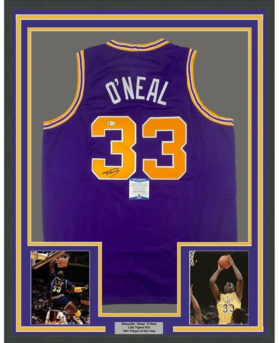 Shaquille O'Neal Signed LSU Jersey Framed With Photos Beckett Authenticated 35x39: Shaquille O'Neal Signed LSU Jersey Framed With Photos Beckett Authenticated 35x39 This is a professionally framed and matted LSU Tigers purple jersey autographed by Shaquille O'Neal. The jersey is aut