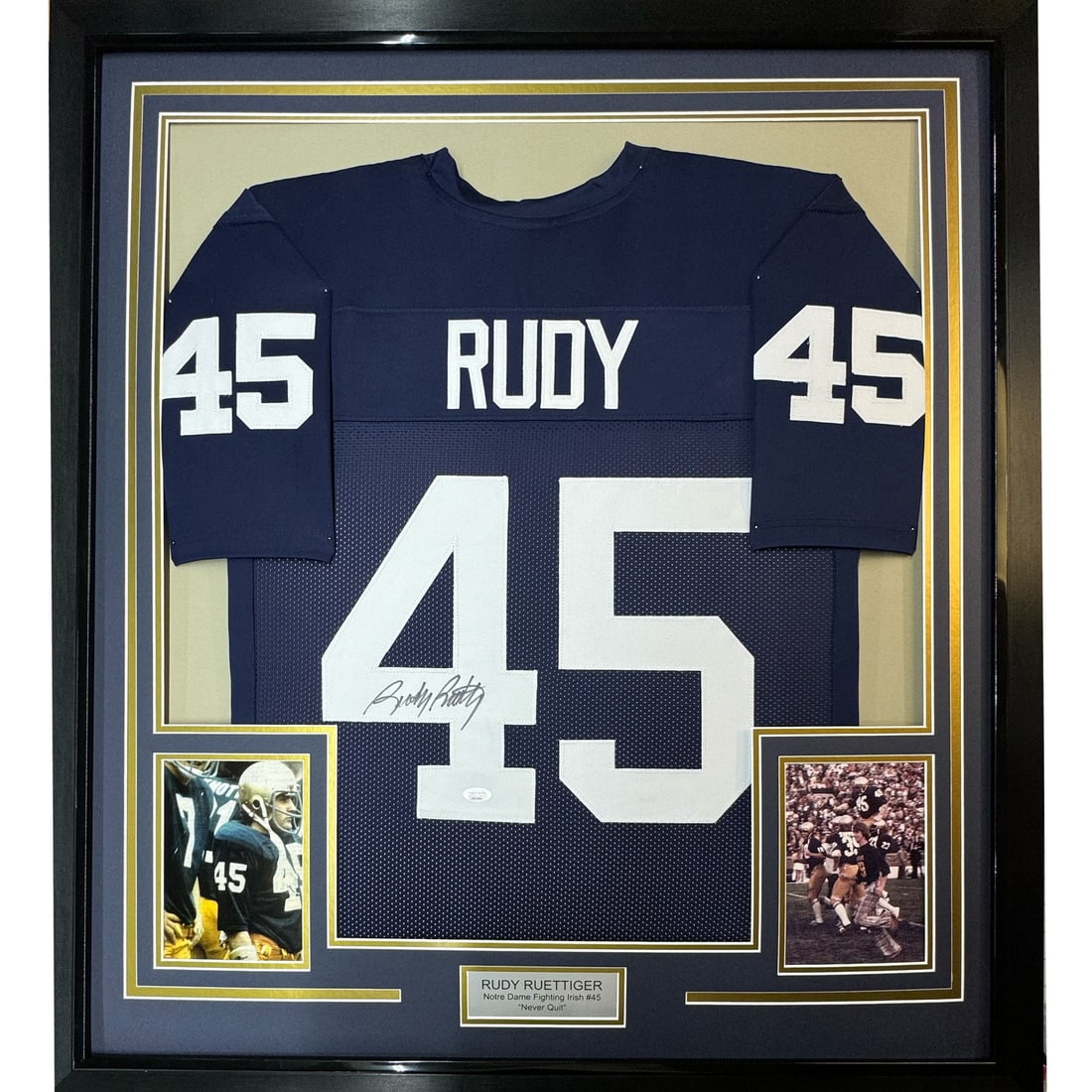 Framed Signed Rudy Ruettiger Notre Dame Jersey with JSA COA 33x42: Framed Signed Rudy Ruettiger Notre Dame Jersey with JSA COA 33x42 Showcase your love for college football with this framed and autographed Rudy Ruettiger Notre Dame blue jersey. This authentic piece f