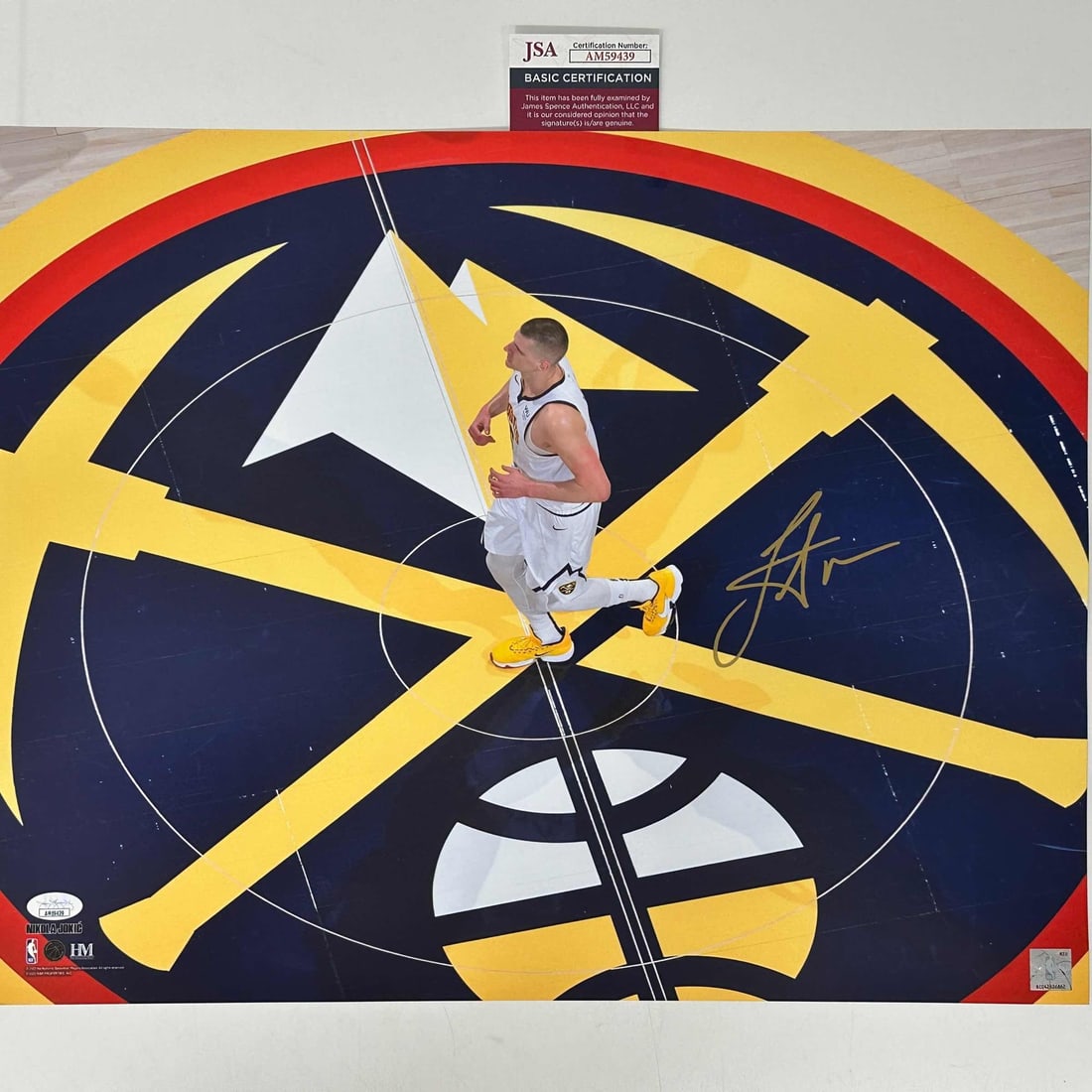 Autographed Nikola Jokic Denver Nuggets 16x20 Photo with JSA Certification: Autographed Nikola Jokic Denver Nuggets 16x20 Photo with JSA Certification This is an authentic 16x20 basketball photo featuring Nikola Jokic of the Denver Nuggets, personally autographed by the playe
