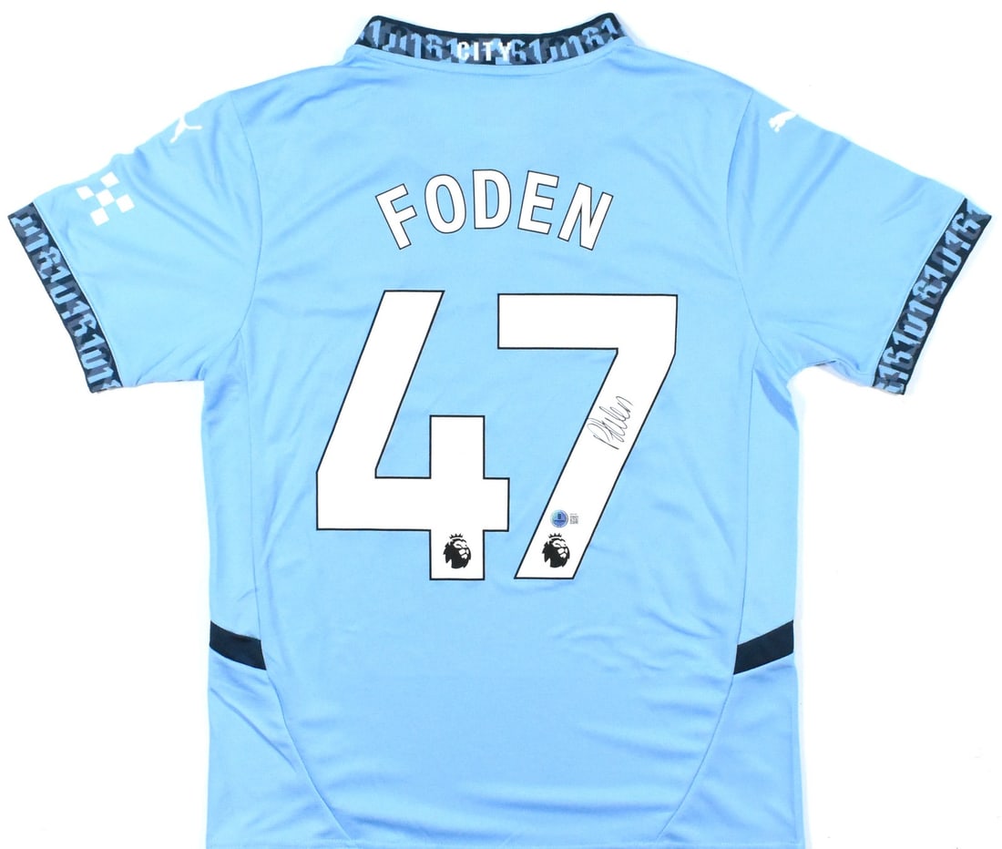 Manchester City Home Jersey Signed by Phil Foden with Beckett Authentication: Manchester City Home Jersey Signed by Phil Foden with Beckett Authentication This is a pre-owned Manchester City home blue soccer jersey, signed by Phil Foden and featuring his number 47. The jersey i