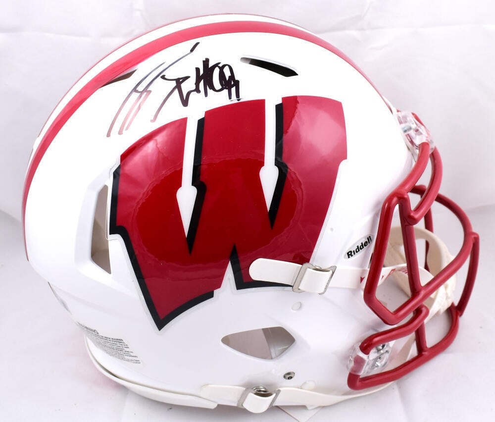 JJ Watt Autographed Wisconsin Badgers Full Size Helmet Beckett Authenticated: JJ Watt Autographed Wisconsin Badgers Full Size Helmet Beckett Authenticated This is an authentic full-size Wisconsin Badgers helmet autographed by NFL star JJ Watt. The helmet is a must-have for any