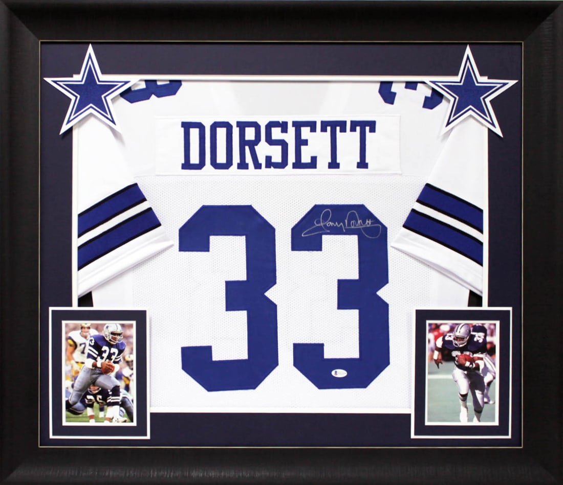 Tony Dorsett Signed White Jersey Framed Dallas Cowboys BAS Authenticated: Tony Dorsett Signed White Jersey Framed Dallas Cowboys BAS Authenticated This authentic, signed white pro-style jersey features the name and number of Tony Dorsett, a celebrated player of the Dallas C