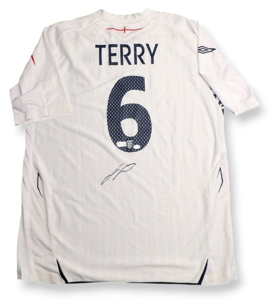 John Terry Autographed England Soccer Jersey Beckett Certified: John Terry Autographed England Soccer Jersey Beckett Certified This authentic John Terry signed jersey is a must-have for any soccer fan and collector. The jersey features the iconic design associated