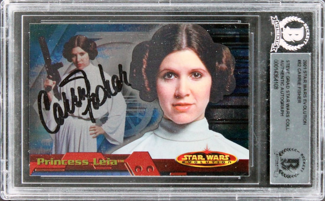 Carrie Fisher Signed Star Wars Evolution Card #62 Beckett Authenticated: Carrie Fisher Signed Star Wars Evolution Card #62 Beckett Authenticated This autographed card features the iconic Carrie Fisher, known for her role as Princess Leia in Star Wars. Authenticated by Beck