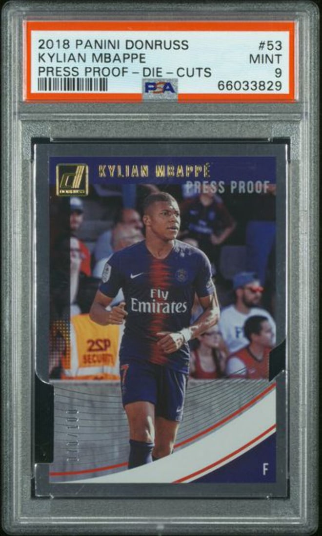 2018 Panini Donruss Kylian Mbappe Press Proof Die Cut Card #53 /100 PSA 9: 2018 Panini Donruss Kylian Mbappe Press Proof Die Cut Card #53 /100 PSA 9 This rare 2018 Panini Donruss Press Proof Die Cut card features Kylian Mbappe, graded 9 by Professional Sports Authenticator (