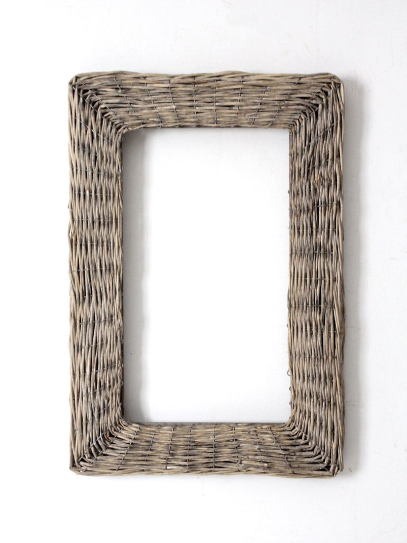 Charming Vintage Wicker Frame in Faded Gray 24.25 x 16.5: Charming Vintage Wicker Frame in Faded Gray 24.25 x 16.5 This vintage wicker frame showcases a charming rectangular design woven in soft, faded gray tones. The weathered surface brings a natural textu