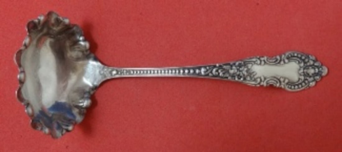 Knowles Mauser Apollo Sterling Silver Ruffled Gravy Ladle 7 3/8": Knowles Mauser Apollo Sterling Silver Ruffled Gravy Ladle 7 3/8" This elegant gravy ladle features the Apollo pattern by Knowles and Mauser, crafted from high-quality sterling silver. The ladle showca