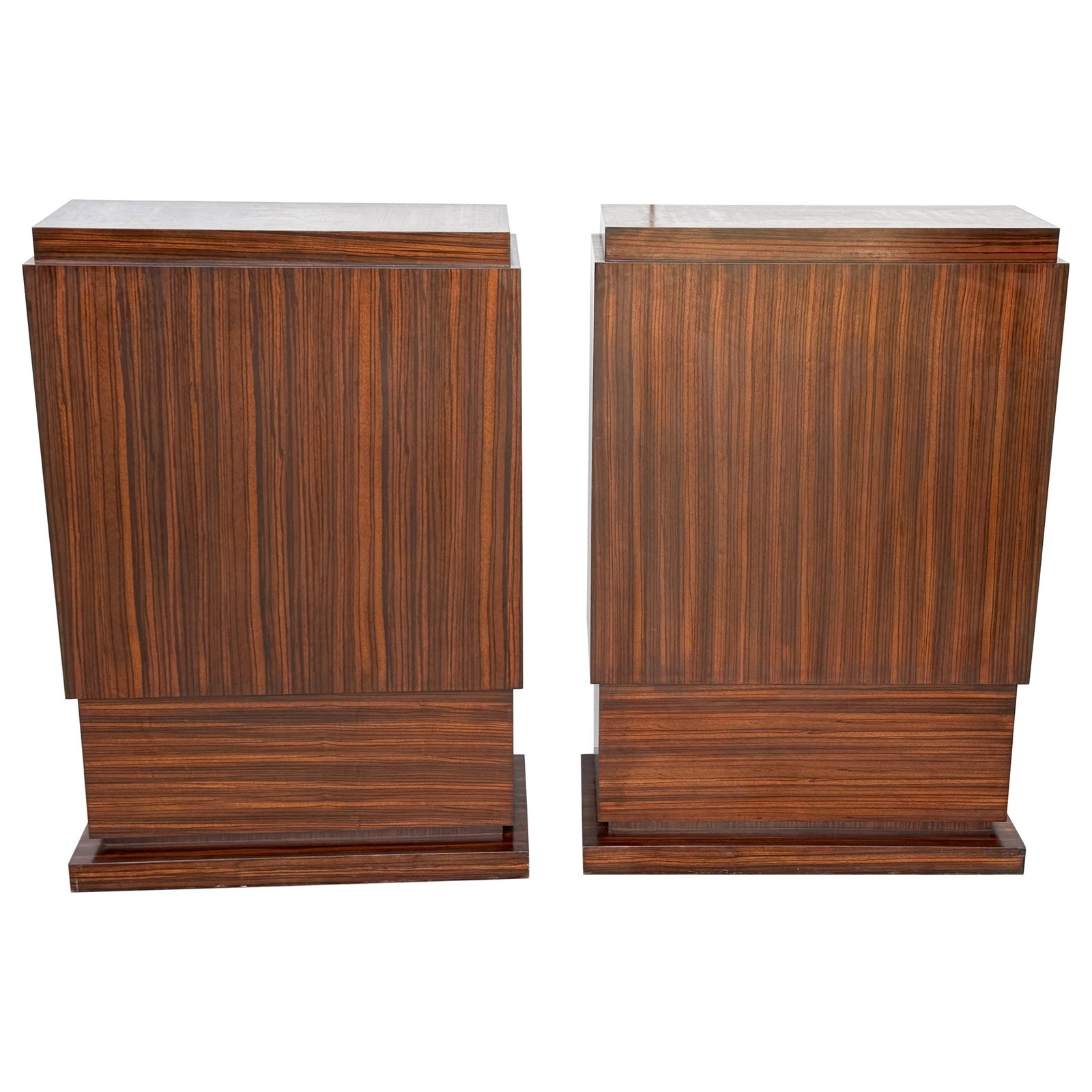 Pair of Art Deco Style Zebrawood Pedestals From Late 20th Century: Pair of Art Deco Style Zebrawood Pedestals From Late 20th Century This large pair of Art Deco-style pedestals is crafted from richly figured zebrawood veneer, known for its dramatic linear grain and w