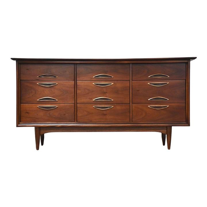 Mid Century Modern Walnut Long Dresser by Hooker 64": Mid Century Modern Walnut Long Dresser by Hooker 64" This mid-century modern long dresser, crafted by Hooker Furniture, features polished inset drawer pulls and showcases a rich walnut finish. Profess
