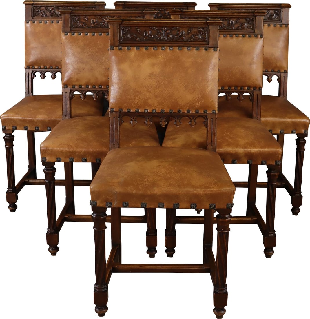 Antique French Gothic Dining Chairs Walnut Synthetic Leather Upholstery: Antique French Gothic Dining Chairs Walnut Synthetic Leather Upholstery This set of French Gothic dining chairs, crafted from rich walnut, showcases intricate Gothic design elements that add a touch o