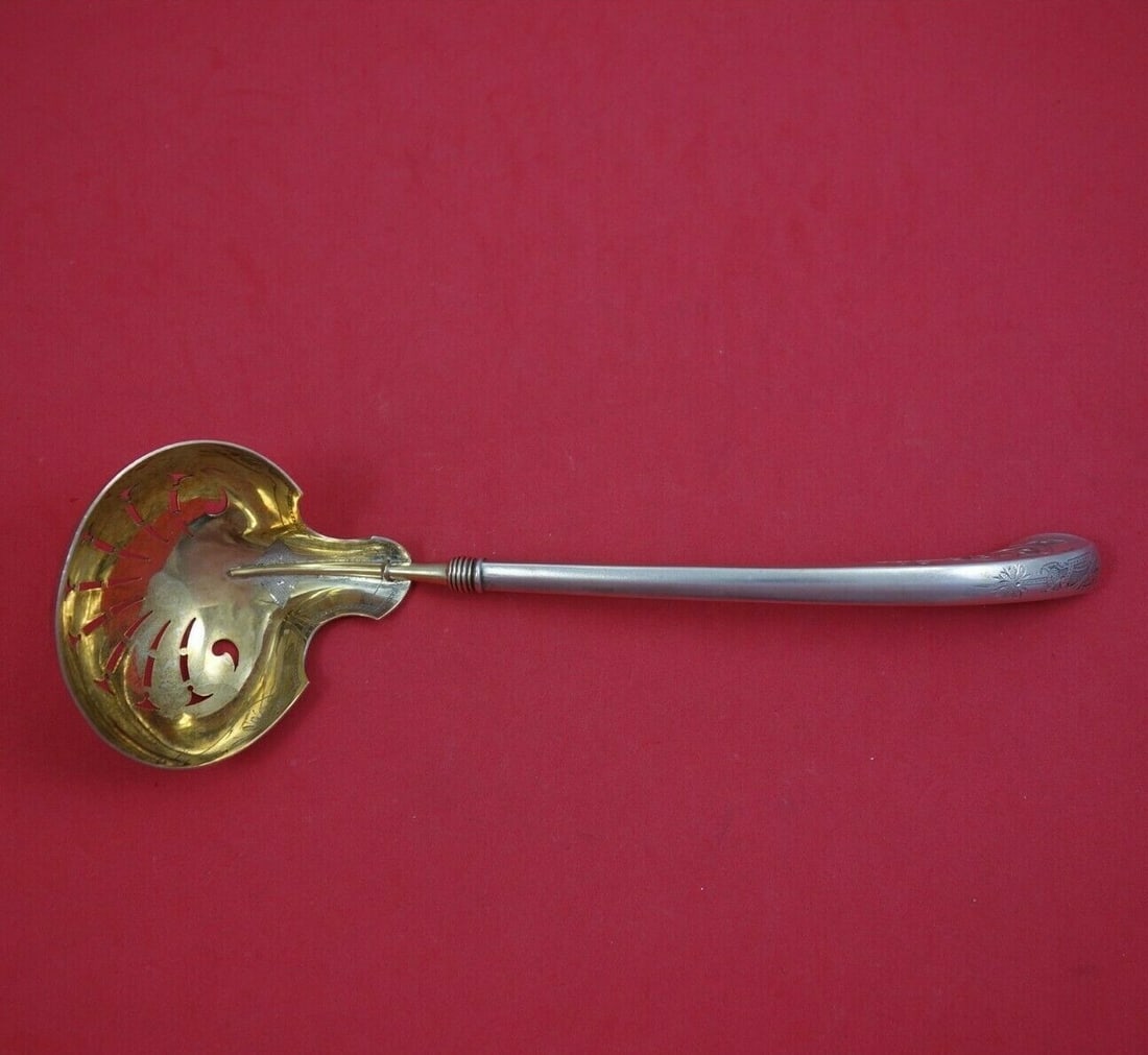 Gorham Angelo Sterling Silver Gold Washed Oyster Ladle 9 1/4": Gorham Angelo Sterling Silver Gold Washed Oyster Ladle 9 1/4" This exquisite Angelo by Gorham Sterling Silver Oyster Ladle features a gold washed and pierced design, measuring 9 1/4 inches in length.