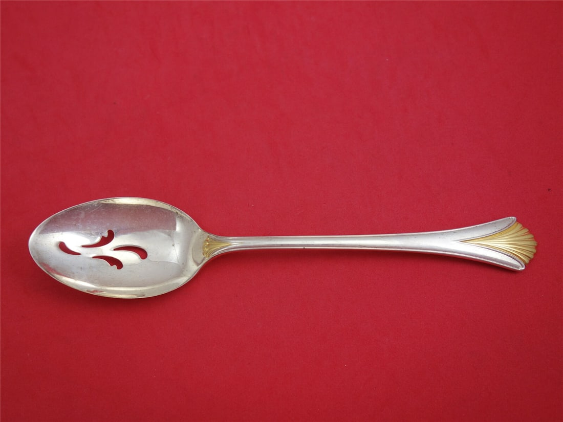 Lunt Regency Shell Gold Sterling Silver Slotted Spoon 8 1/2 inches: Lunt Regency Shell Gold Sterling Silver Slotted Spoon 8 1/2 inches Elevate your dining experience with this exquisite Regency Shell Gold by Lunt Sterling Silver Serving Spoon. Measuring 8 1/2 inches,