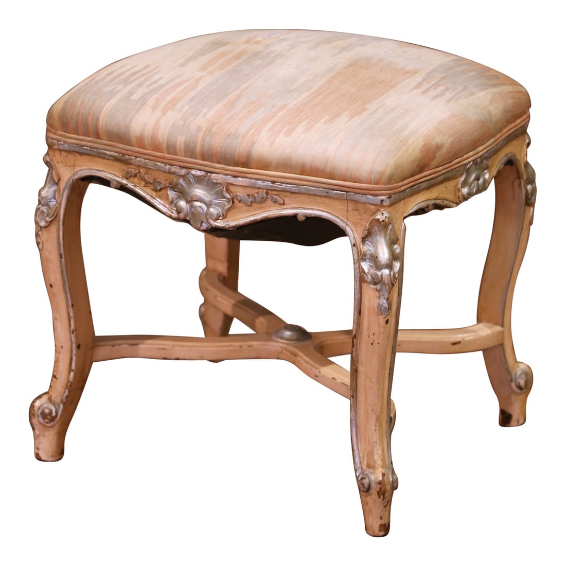 Louis XV Style French Painted Beech Stool with Carved Shell Details and X-Base: Louis XV Style French Painted Beech Stool with Carved Shell Details and X-Base This decorative mid-century French stool, crafted circa 1960 in the Louis XV style, features a hand-carved beechwood fram