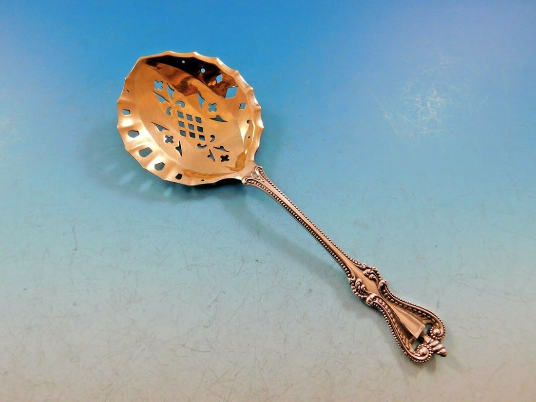 Towle Old Colonial Sterling Silver Confection Spoon Gold Washed Pierced 6 1/4": Towle Old Colonial Sterling Silver Confection Spoon Gold Washed Pierced 6 1/4" Experience the elegance of the 19th century with this exquisite Old Colonial confection spoon by Towle. Crafted from high