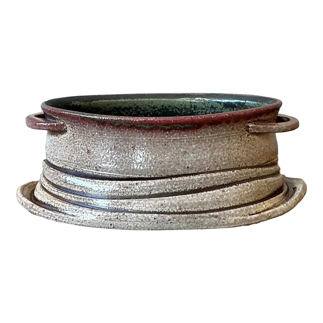 Handcrafted Oval Stoneware Bowl With Handles And Oxblood Rim 8.5" Wide: Handcrafted Oval Stoneware Bowl With Handles And Oxblood Rim 8.5" Wide This vintage studio pottery bowl showcases hand-built craftsmanship typical of the Mid-Century Organic Modern movement. Crafted f